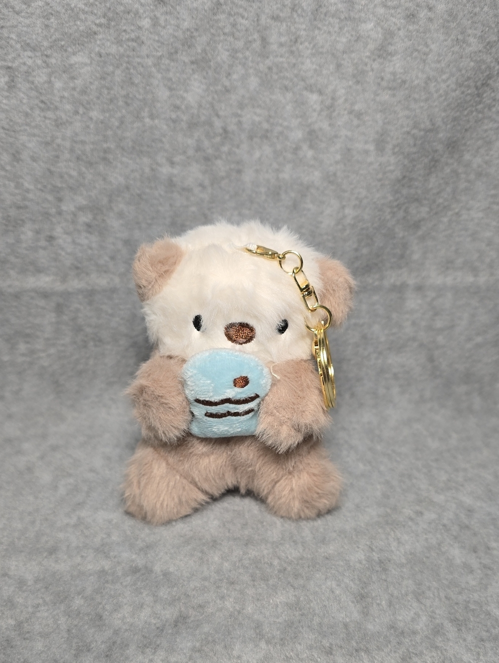 Plush Otter Keychain/Bagcharm with Playful Blue Fishy